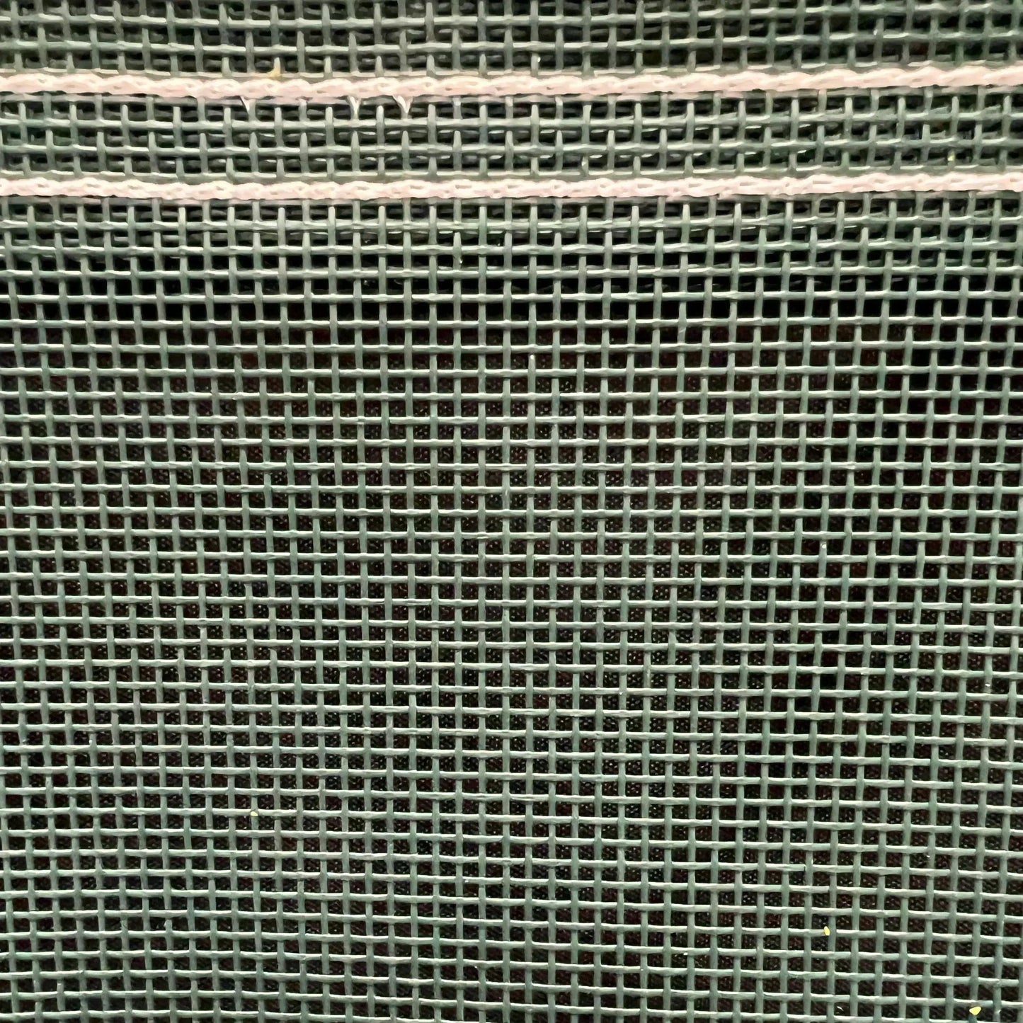 Green 12' x 16' vinyl mesh tarp showcasing flexible vinyl mesh construction