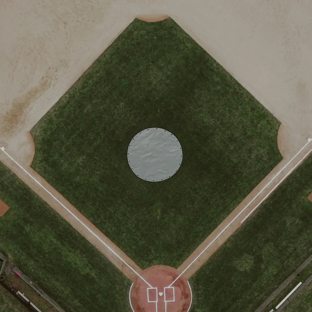 25' mound cover serving as an athletic surface guard against rain and debris