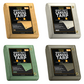 Set of four Tarps Plus 16oz heavy-duty canvas tarps in tan, white, green, and olive drab; each features reinforced edges, brass grommets, and wax-treated water resistance.