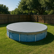 Round above-ground pool with cover on grassy lawn