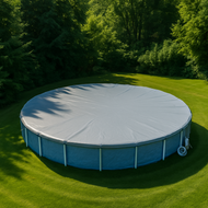 Round above-ground pool with cover on a grassy area with trees in the background