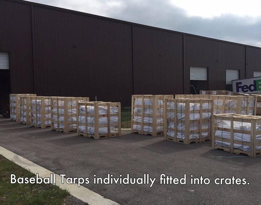 folded 100' x 100' baseball field tarp prepared for storage and field maintenance use