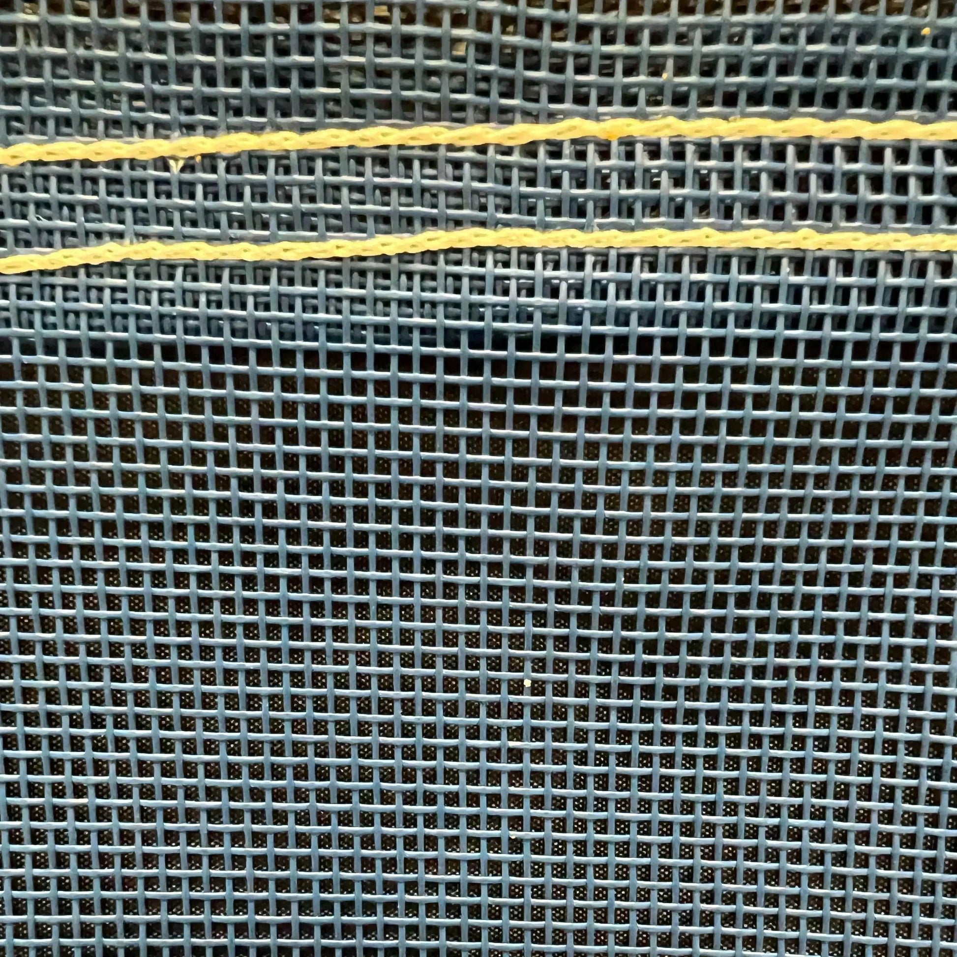 Blue 6' x 8' vinyl mesh tarp displaying breathable weave construction and edge support