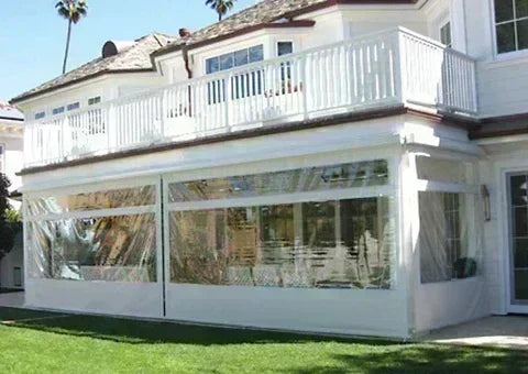 Clear 10' x 20' fire retardant vinyl tarp creating a building front barrier