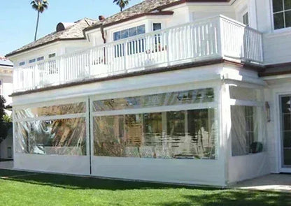 Clear 10' x 20' fire retardant vinyl tarp creating a building front barrier