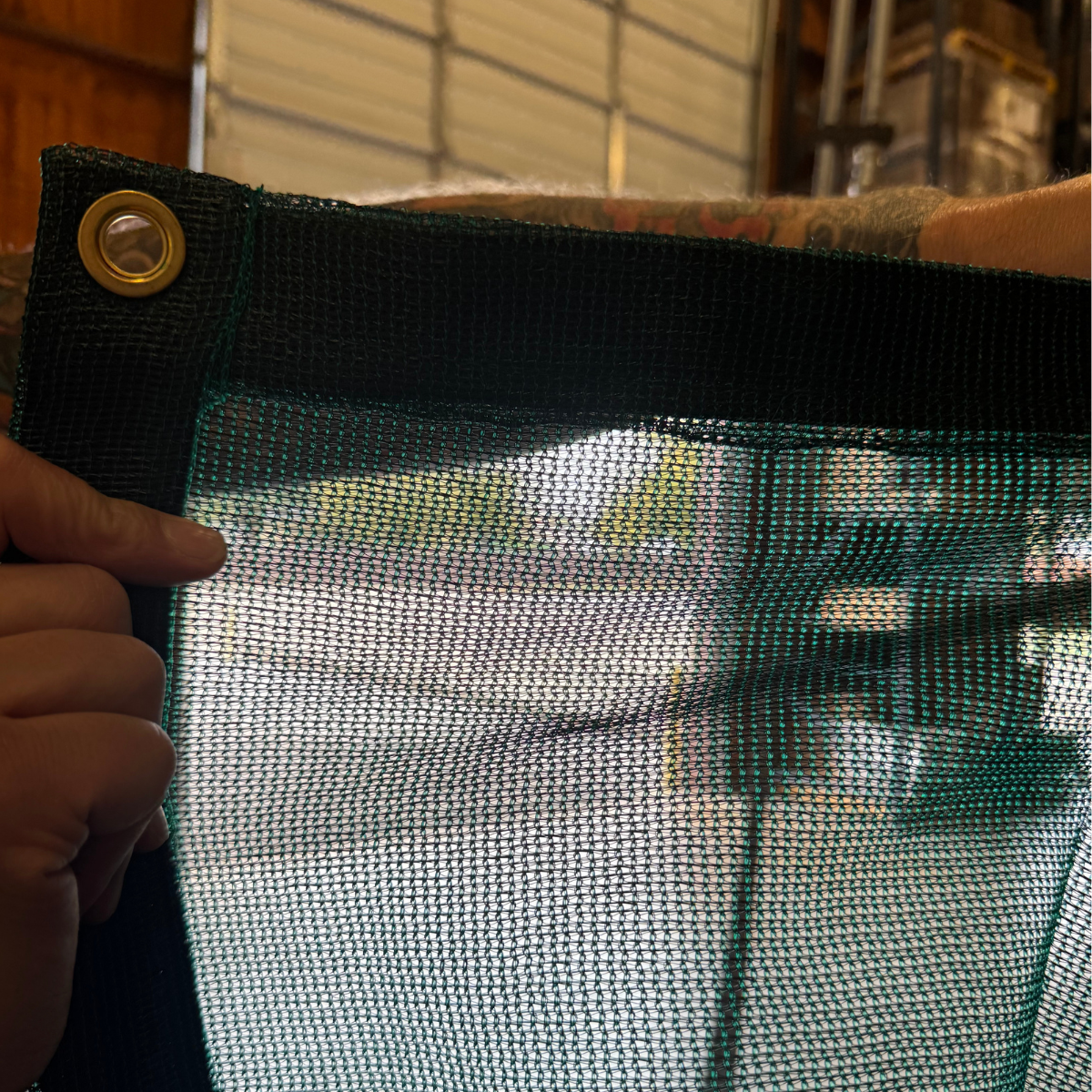 Closeout 60% green mesh tarp 8' x 50' providing a ventilated cover solution for outdoor protection