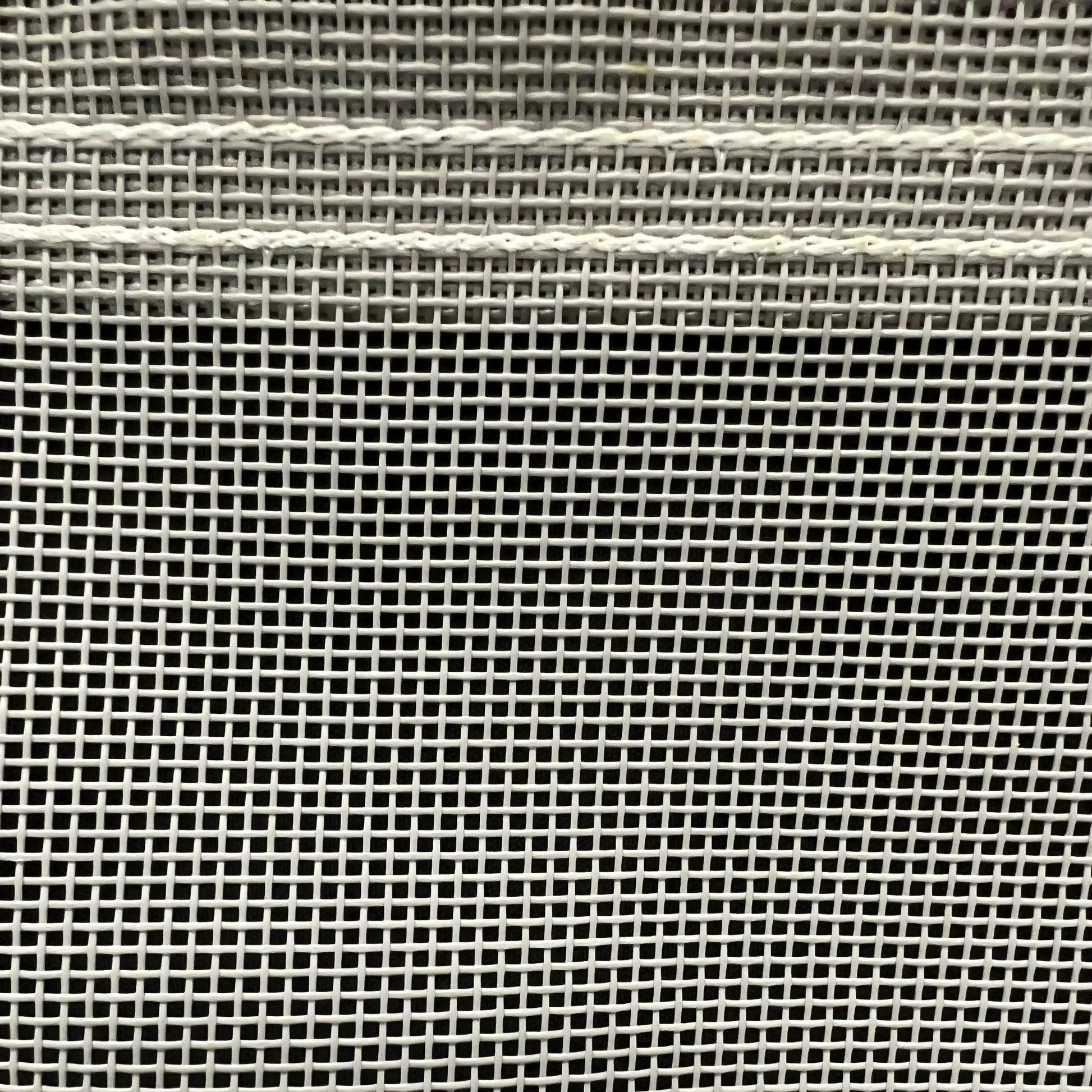 Gray 16' x 20' vinyl mesh tarp showcasing dense vinyl weave and stitched seams