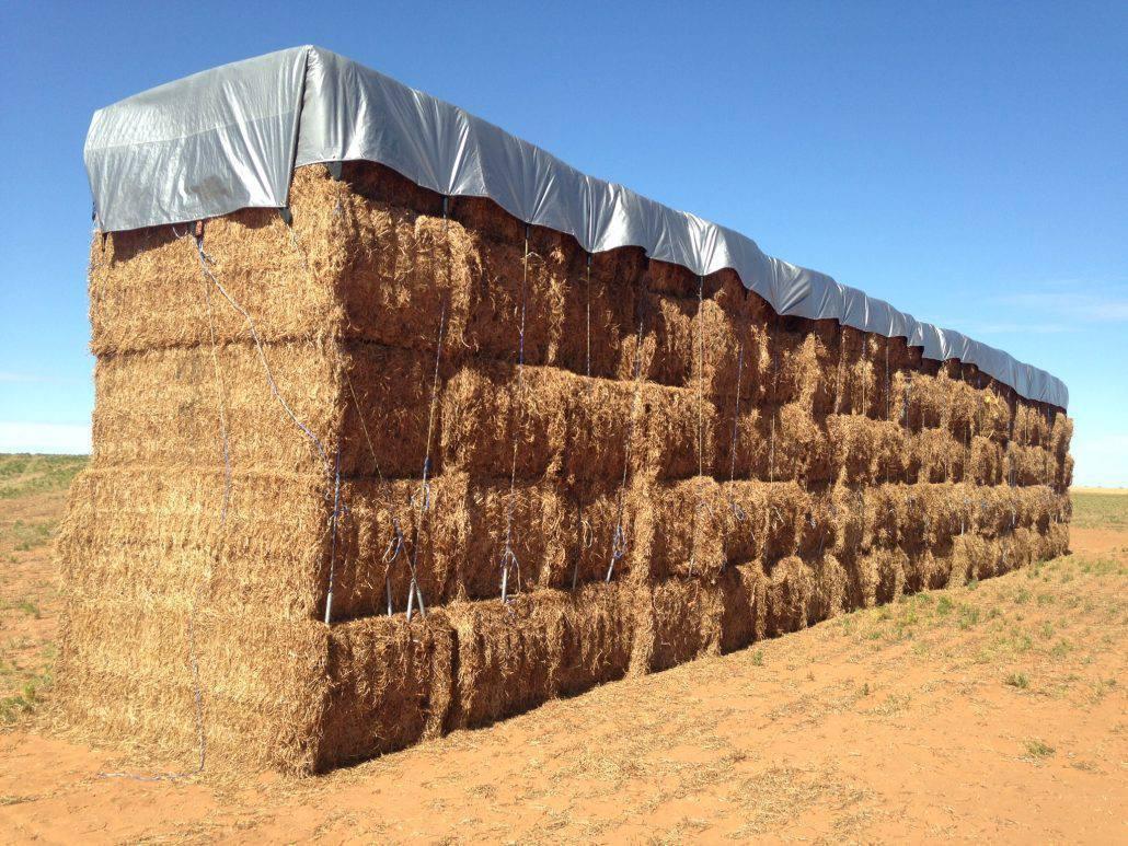 Hay Tarp 33' x 48' covering stored hay bales for outdoor protection