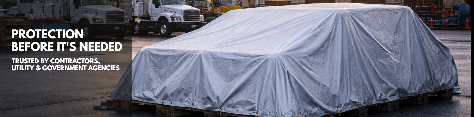 Heavy-duty tarps protecting equipment at a utility operations facility, trusted by government and commercial buyers of tarps