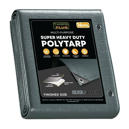 silver/black 20' x 30' poly tarp covering manufacturing equipment
