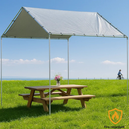 Silver 10' x 10' tarp cover creating backyard shade protection