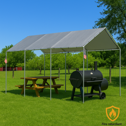 Silver 10' x 20' tarp cover creating shade above a park picnic setup
