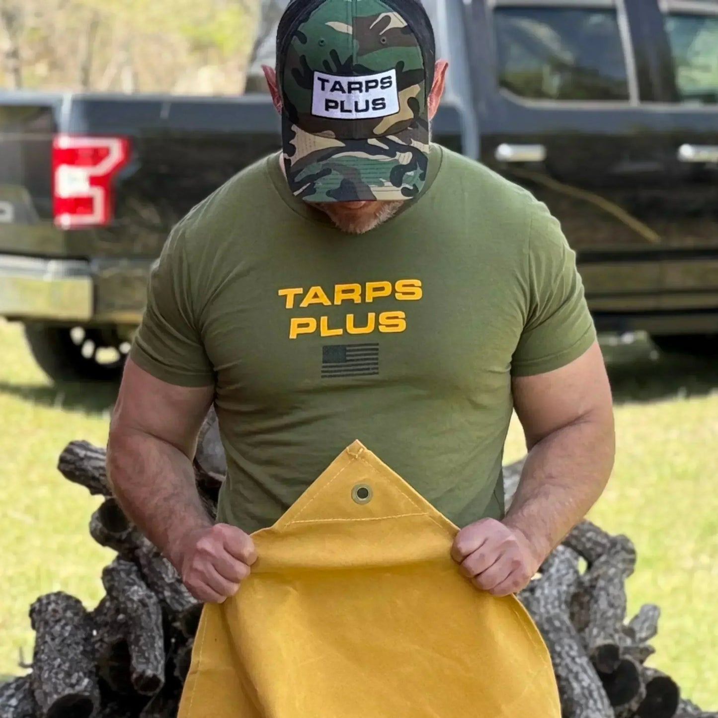 Tan 8' x 10' canvas tarp presented in outdoor utility product demonstration