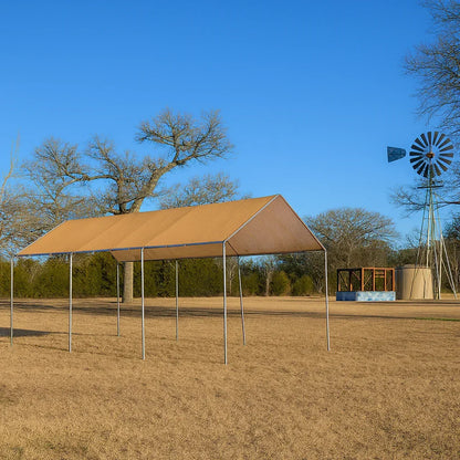 Tan 10' x 20' mesh tarp canopy providing coverage for a coastal picnic area