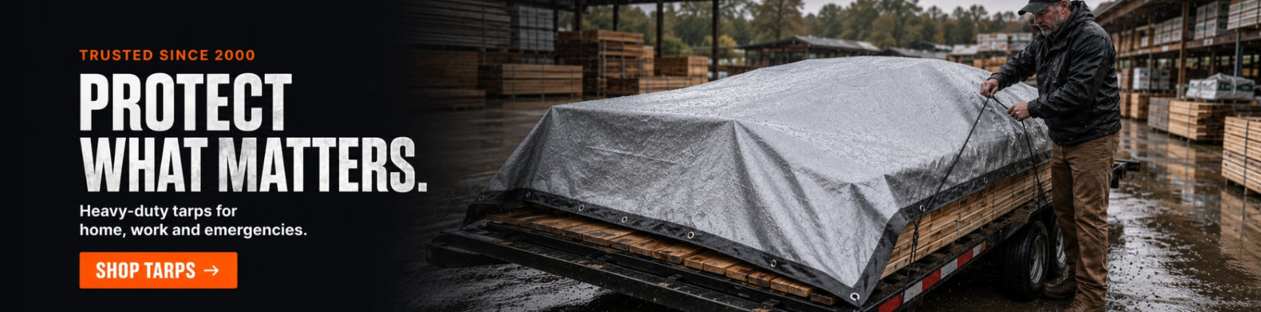 Tarps heavy-duty silver tarp protecting lumber on a utility trailer in the rain