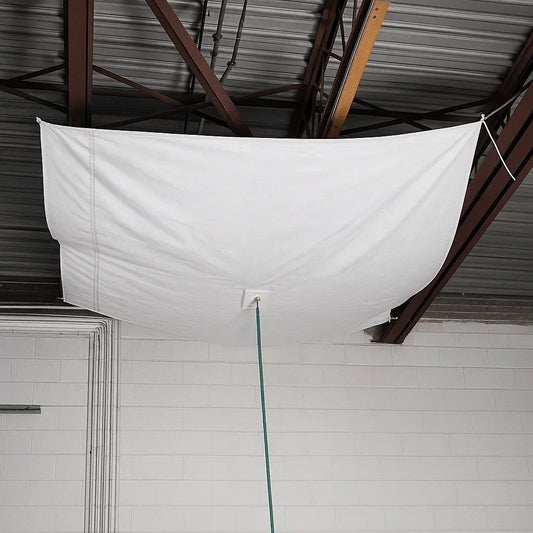 White drain tarp 10' x 10' creating a water containment basin for facility protection