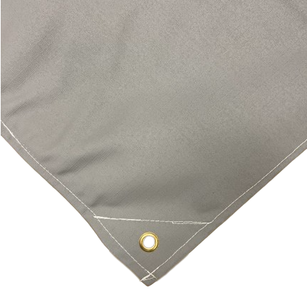 Close-up of gray waterproof ripstop canvas tarp corner featuring reinforced stitching and a brass grommet; durable and ideal for heavy-duty outdoor use.